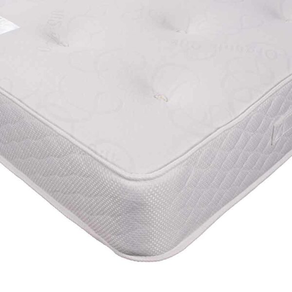 corner of zircon pocket sprung mattress with white hand tufted cover and quilted borders - Sussex Beds